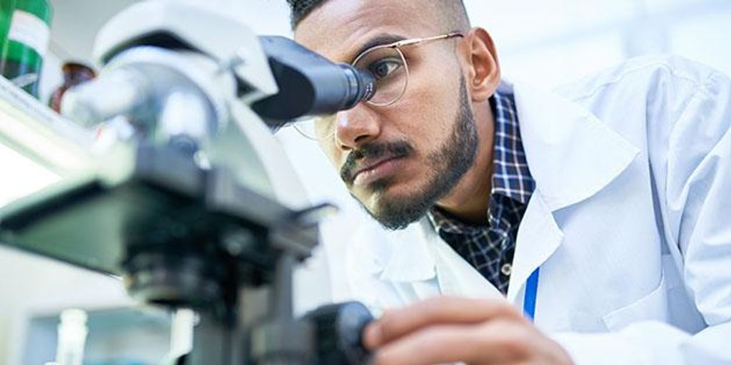 medical research laboratory with scientists examining side effects