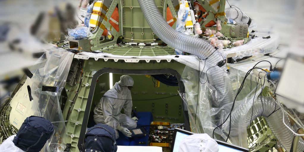 man holding a capsule with visible power and energy symbols around, health and wellness concept